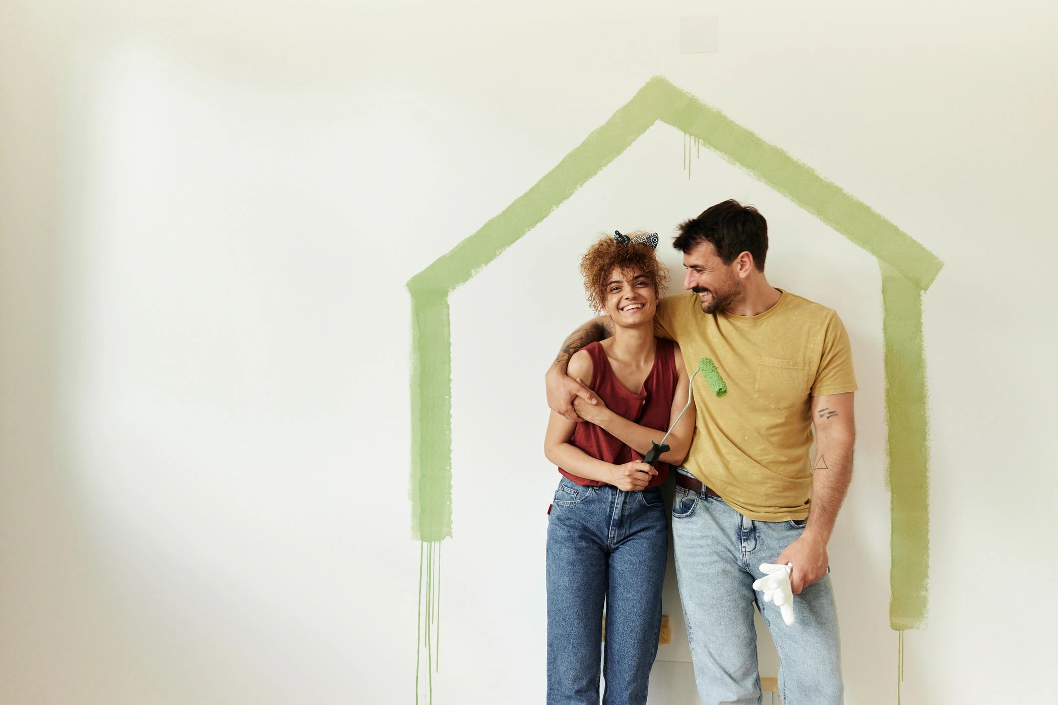 happy homeowner with painted wall